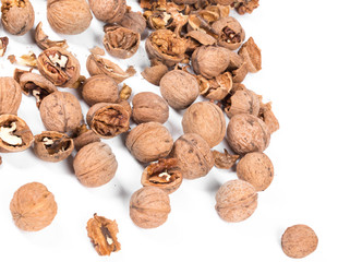 Heap of cracked walnuts.