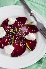 roasted beet salad with goat cheese and sesame seeds, vegetarian