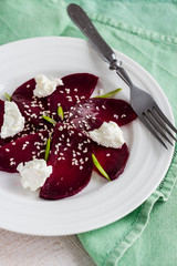roasted beet salad with goat cheese and sesame seeds, vegetarian