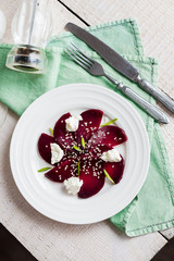 roasted beet salad with goat cheese and sesame seeds, vegetarian