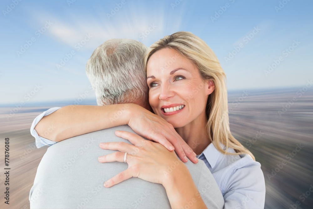 Aufkleber composite image of happy couple standing and hugging