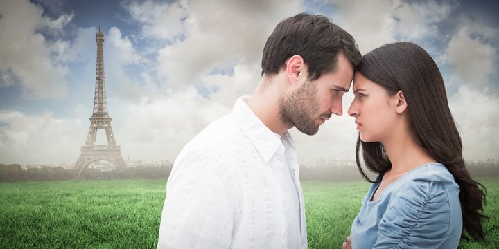 Composite image of angry couple staring at each other