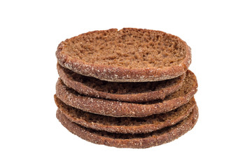 Stack of traditional round Finnish rye breads, isolated on white