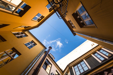 Bottom view from the atrium of the red houses in Riga - Powered by Adobe