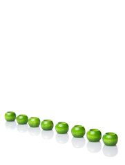 Green wooden beads over white background