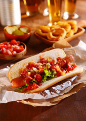 Hot dog topped with fresh vegetable relish