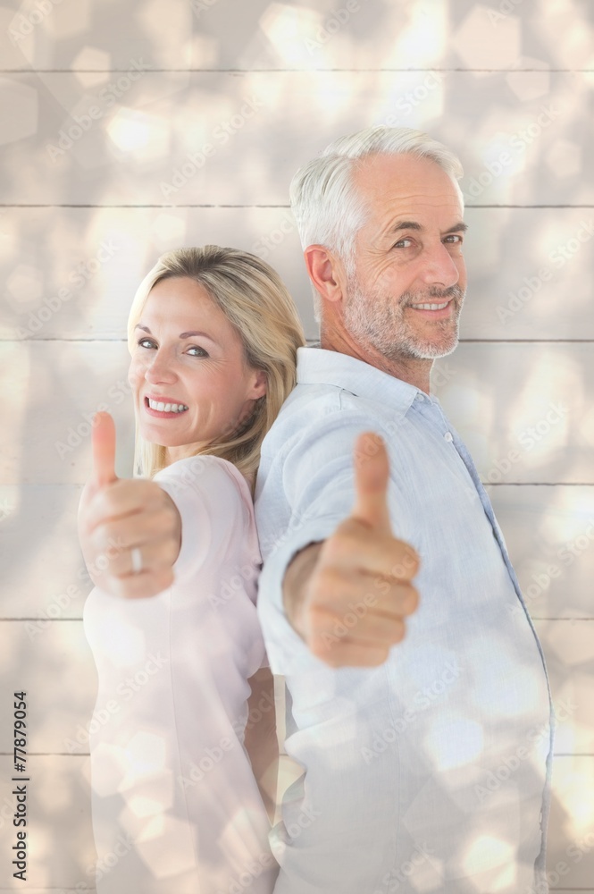 Aufkleber composite image of smiling couple showing thumbs up together
