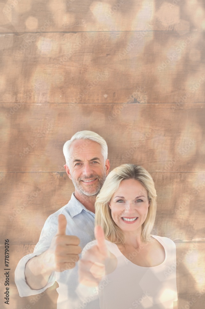 Aufkleber composite image of smiling couple showing thumbs up together