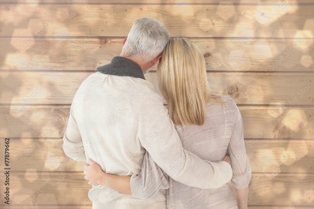 Poster composite image of happy couple standing with arms around