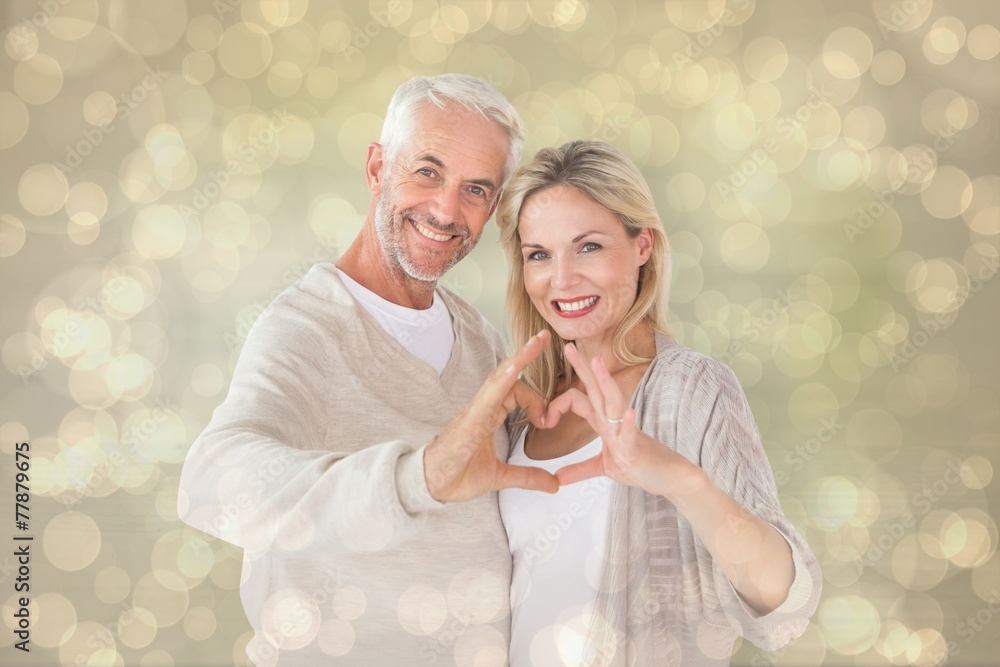 Poster composite image of happy couple forming heart shape with hands