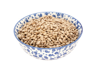 Sunflower seed hearts in a blue and white china bowl
