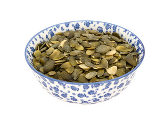 Pumpkin seeds in a blue and white china bowl