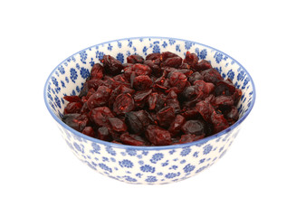 Dried cranberries in a blue and white china bowl