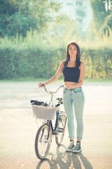 young beautiful brunette straight hair woman using bike