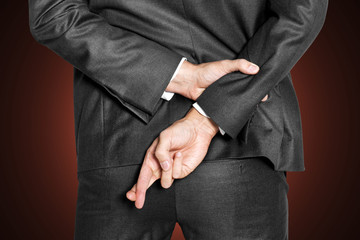 Liar businessman cross his finger