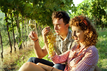Fototapeta premium farming couple relaxing after the grape harvest