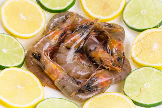 Sliced lemons and shrimps