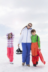 family having fun in the snow