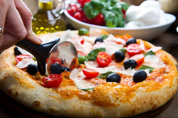 Delicious fresh pizza served on wooden table