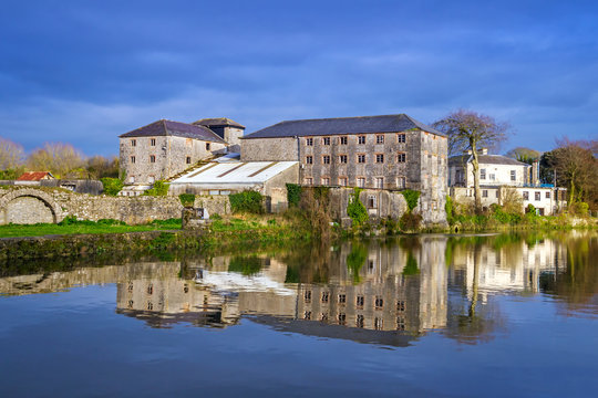 Irish stone architecture with reflection in the river, Askeaton