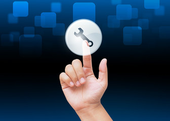Hand pressing repair or tool buttons with technology background