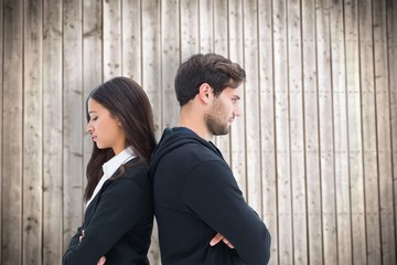 Composite image of unhappy couple not speaking to each other