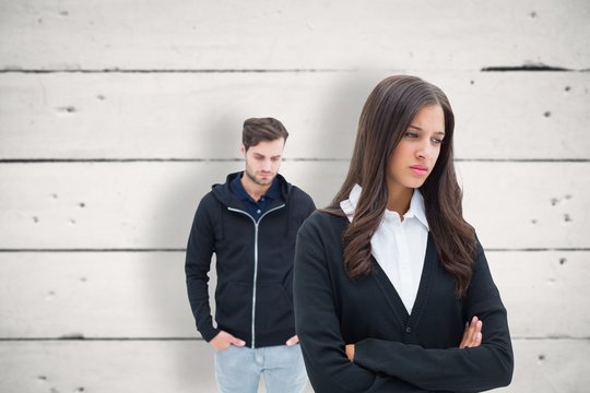 Composite image of unhappy couple not speaking to each other