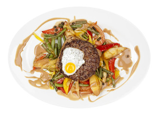 Grilled steaks,fried egg and vegetables