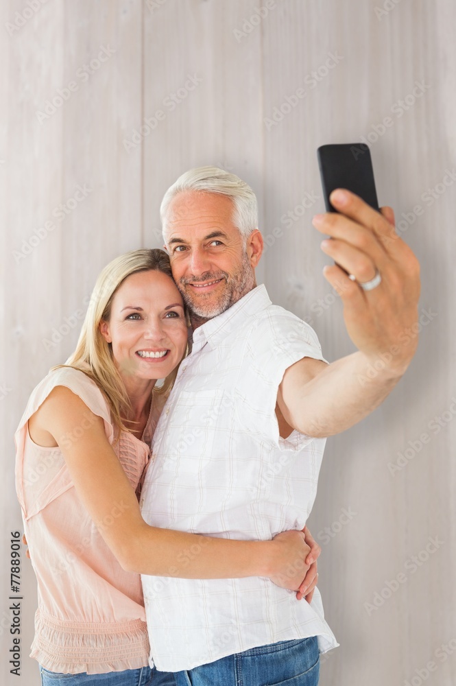 Poster composite image of happy couple posing for a selfie