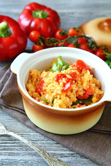 Rice with vegetables in a pot on boards
