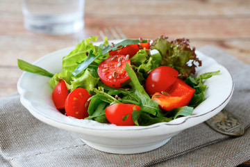 salad with vegetables in a plate on the napkin