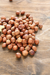 Delicious hazelnuts on wooden surface