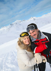 Couple of skiers enjoying winter vacation