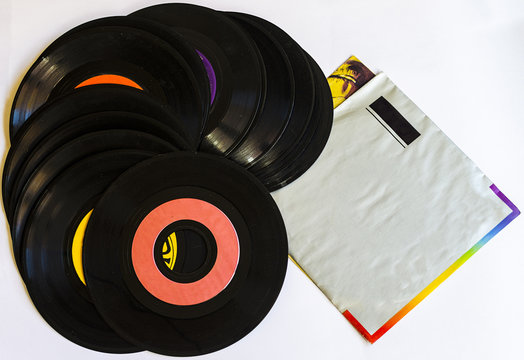 Old beat up 45s and their paper sleeves