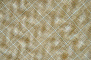 Brown and blue guncheck pattern on fabric.Rhombus tartan design. - 77896035