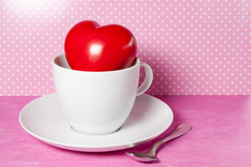 red heart in a white cup