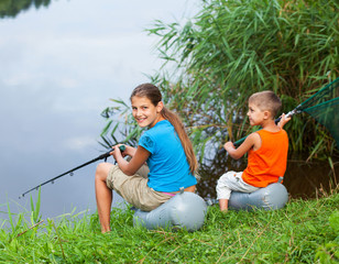 Kids fishing at the river