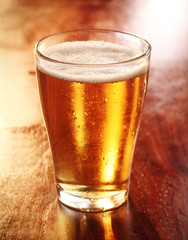 Glass of chilled golden lager or beer