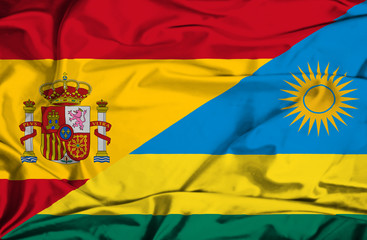 Waving flag of Rwanda and Spain