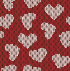 Knitted background with the image of hearts. Valentine's Day