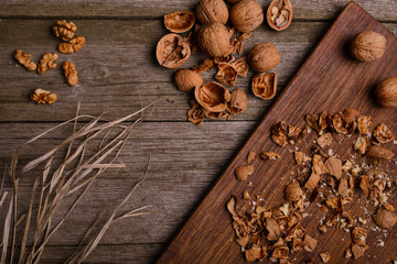 Walnuts on rustic wooden background copy space for text