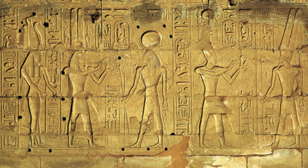 Hieroglyphic carvings in ancient egyptian temple