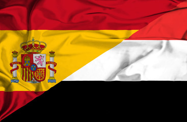 Waving flag of Yemen and Spain