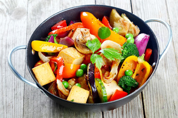 Healthy snack of roast vegetables and tofu