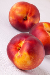 Three tasty fresh ripe juicy nectarines