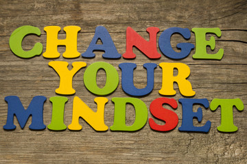 Change your mindset text on a wooden background