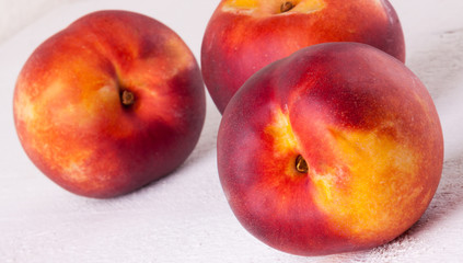 Three tasty fresh ripe juicy nectarines