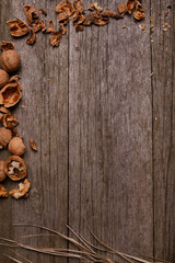Walnuts on rustic wooden background copy space for text