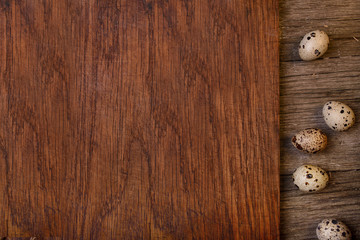 Obraz na płótnie Canvas Empty wooden rustic board quail eggs, copy space for text