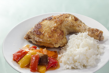 Fried chicken leg with rice and vegetables